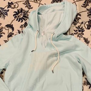A baby blue, Under Armour sweatshirt.